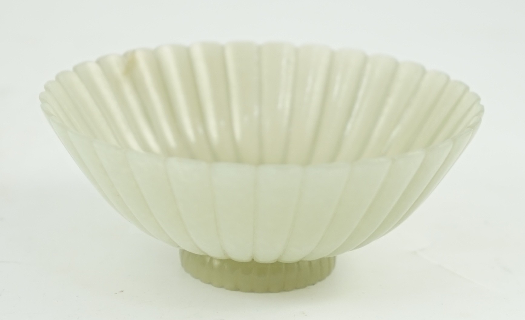 A fine Chinese Mughal style celadon jade ‘chrysanthemum’ bowl, 18th/19th century, 9.4cm diameter